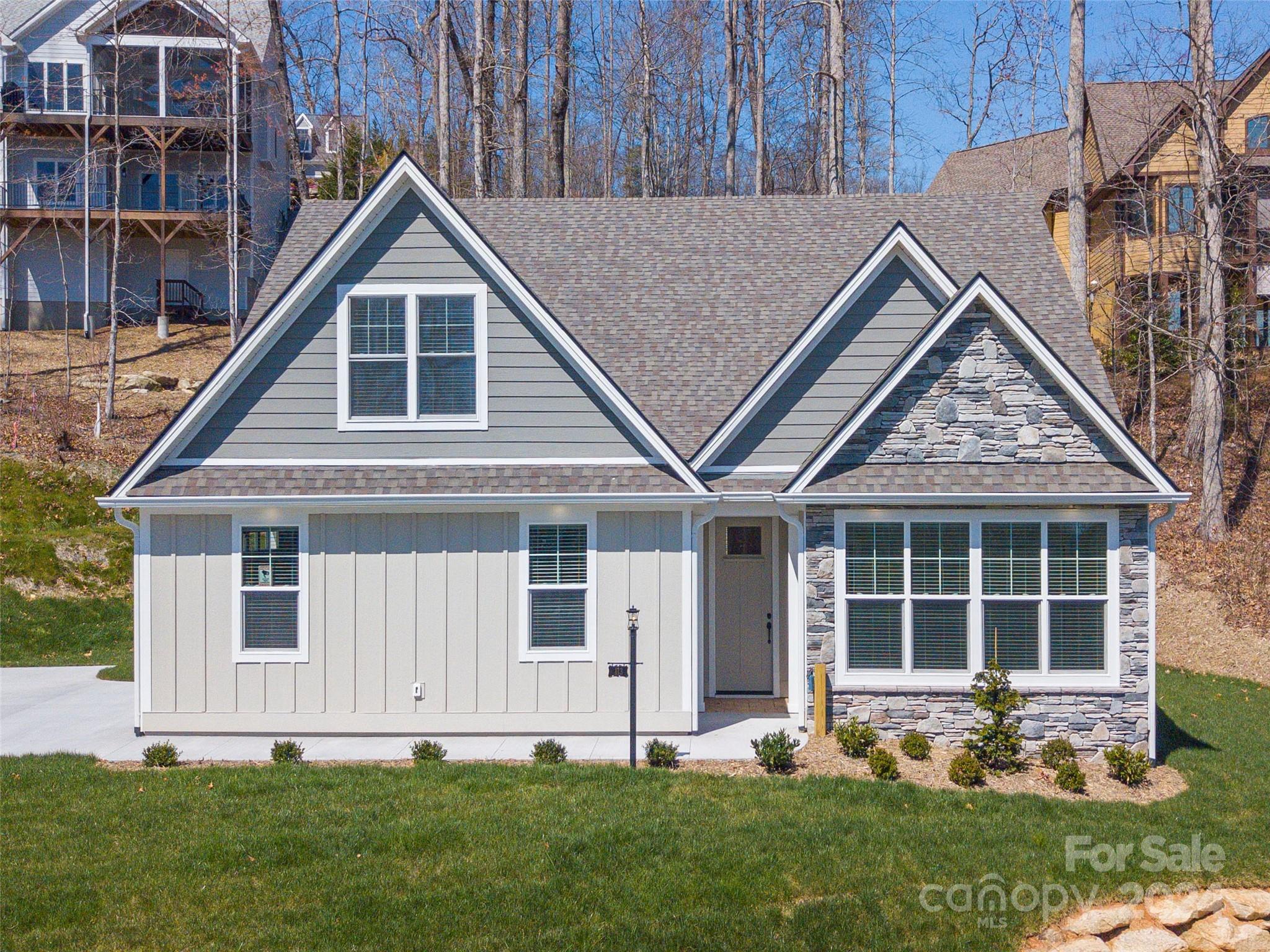 113 Millbrae Loop Hendersonville, NC 28791 - Photo 2 of 35 a front view of a house with a yard