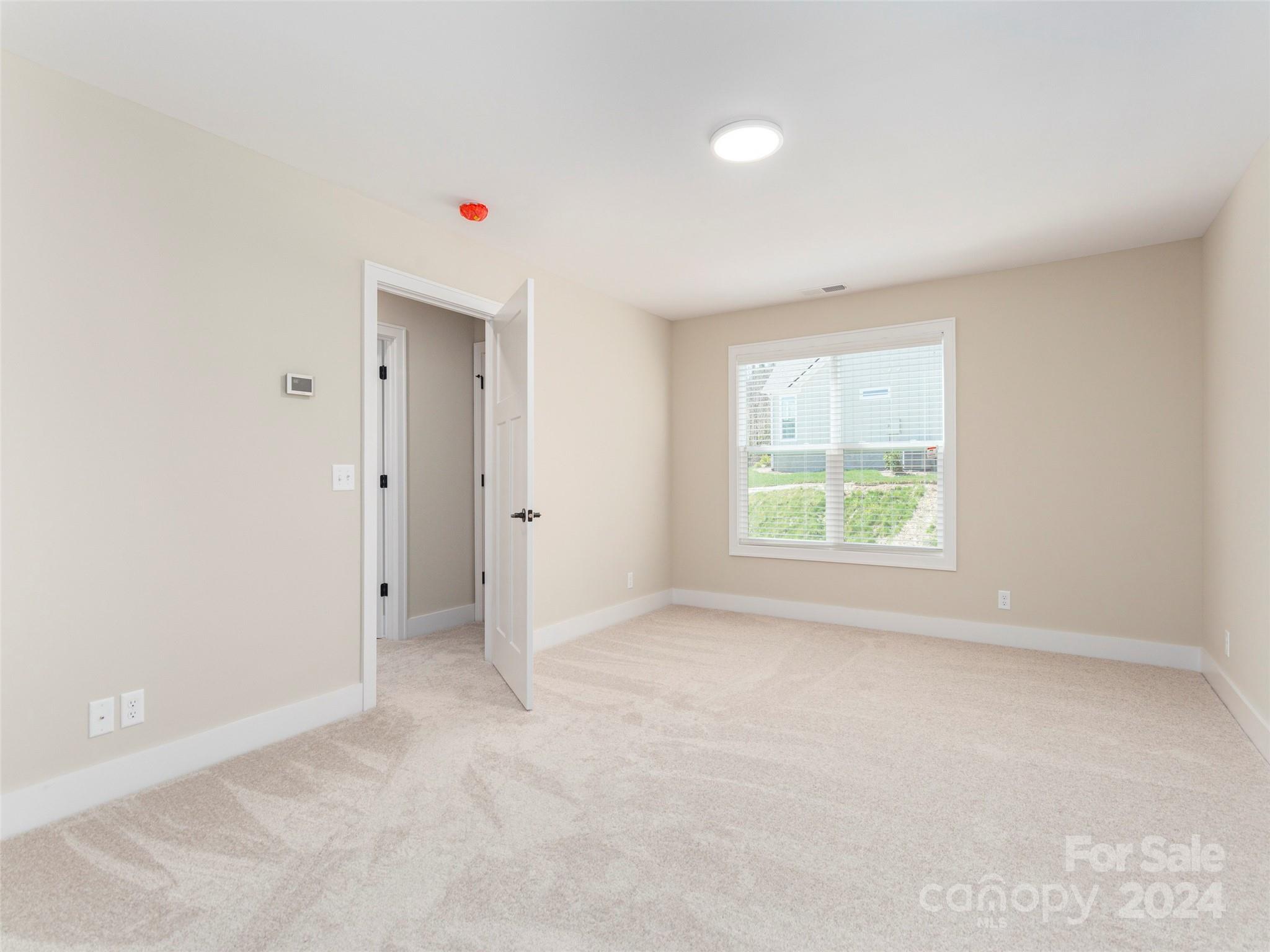 113 Millbrae Loop Hendersonville, NC 28791 - Photo 24 of 35 an empty room with windows and closet