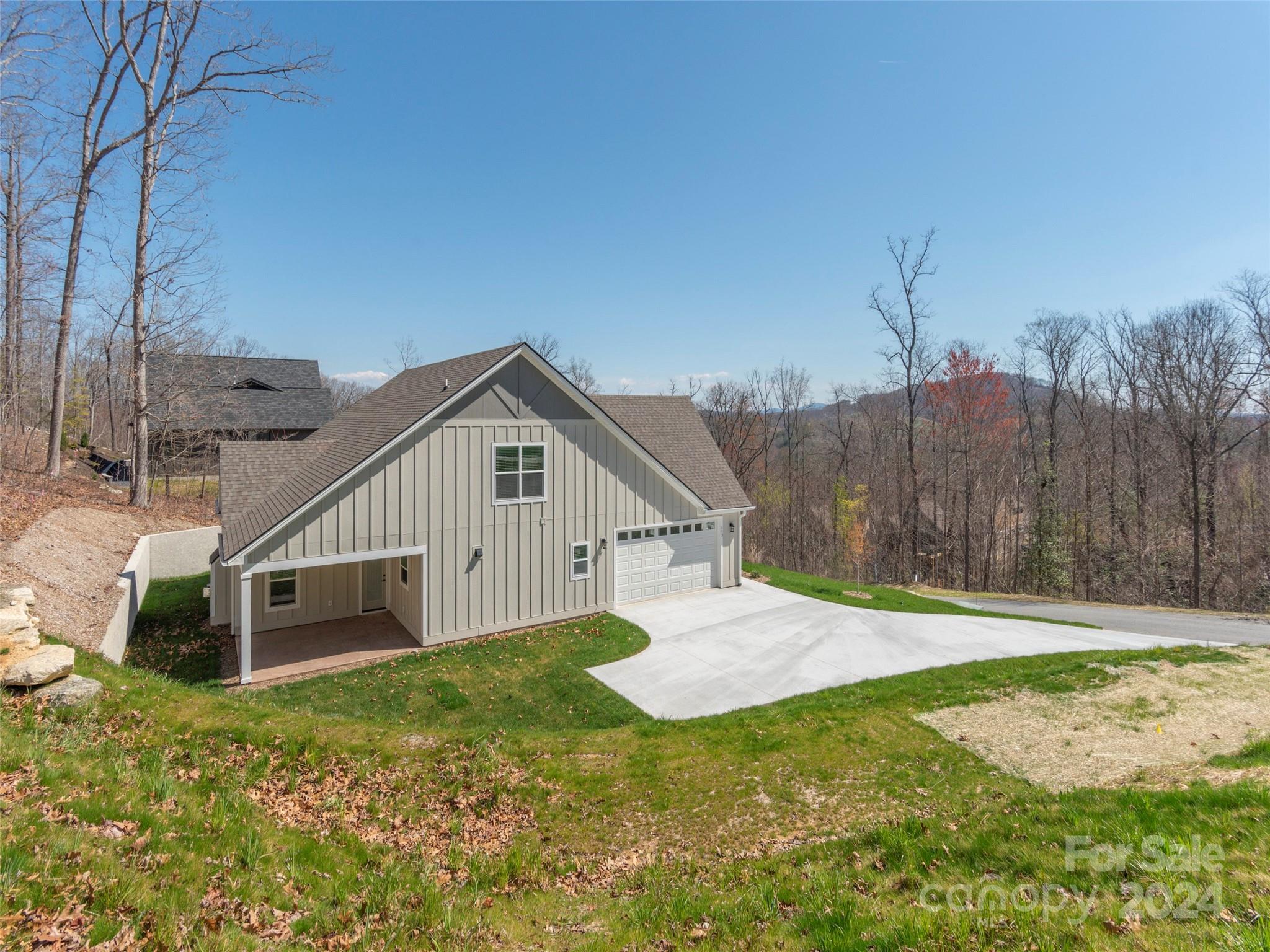 113 Millbrae Loop Hendersonville, NC 28791 - Photo 28 of 35 a house with green field in front of it