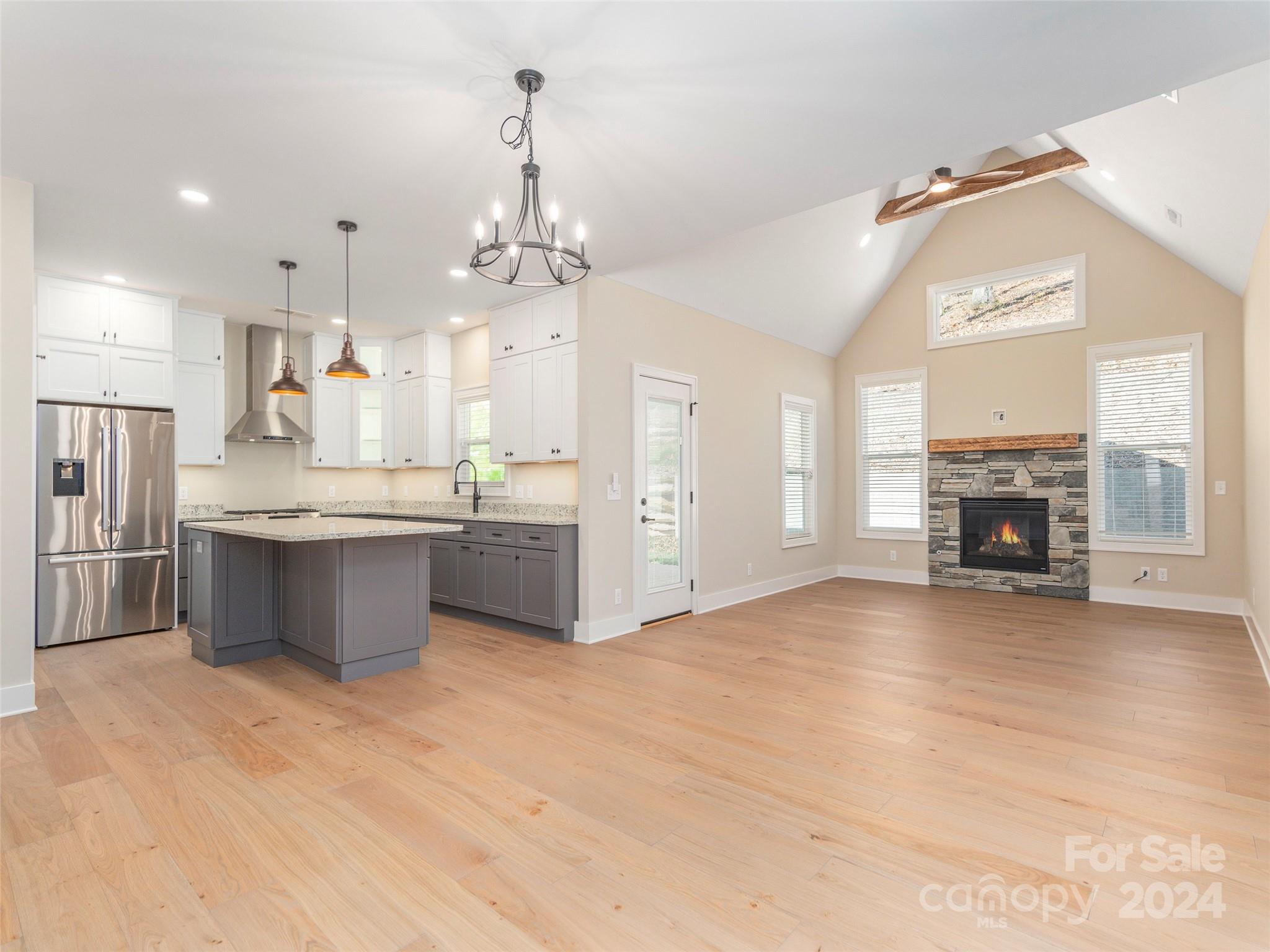 113 Millbrae Loop Hendersonville, NC 28791 - Photo 6 of 35 a large white kitchen with a large window stainless steel appliances and kitchen view