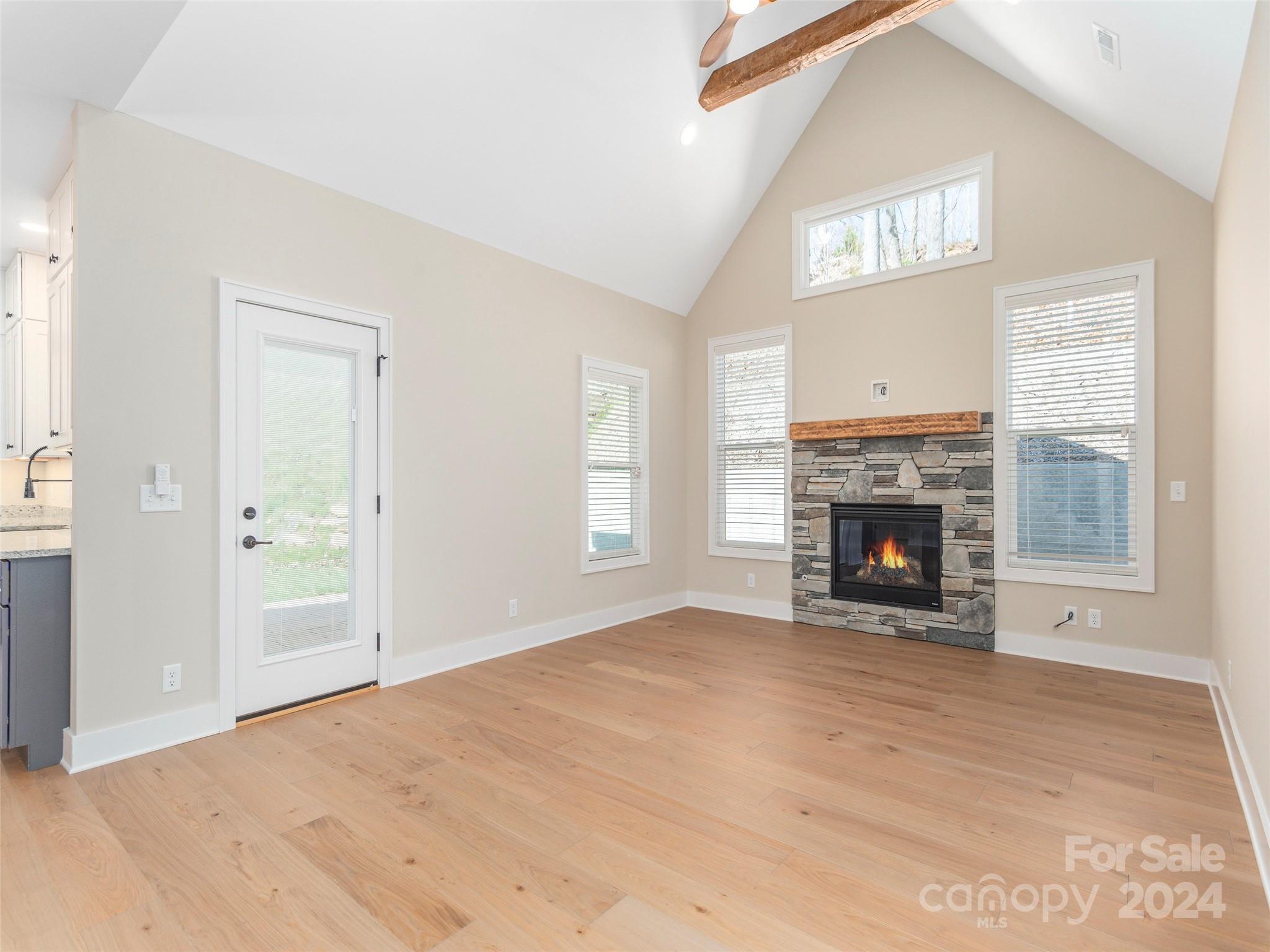 113 Millbrae Loop Hendersonville, NC 28791 - Photo 7 of 35 a view of empty room with fireplace and wooden floor