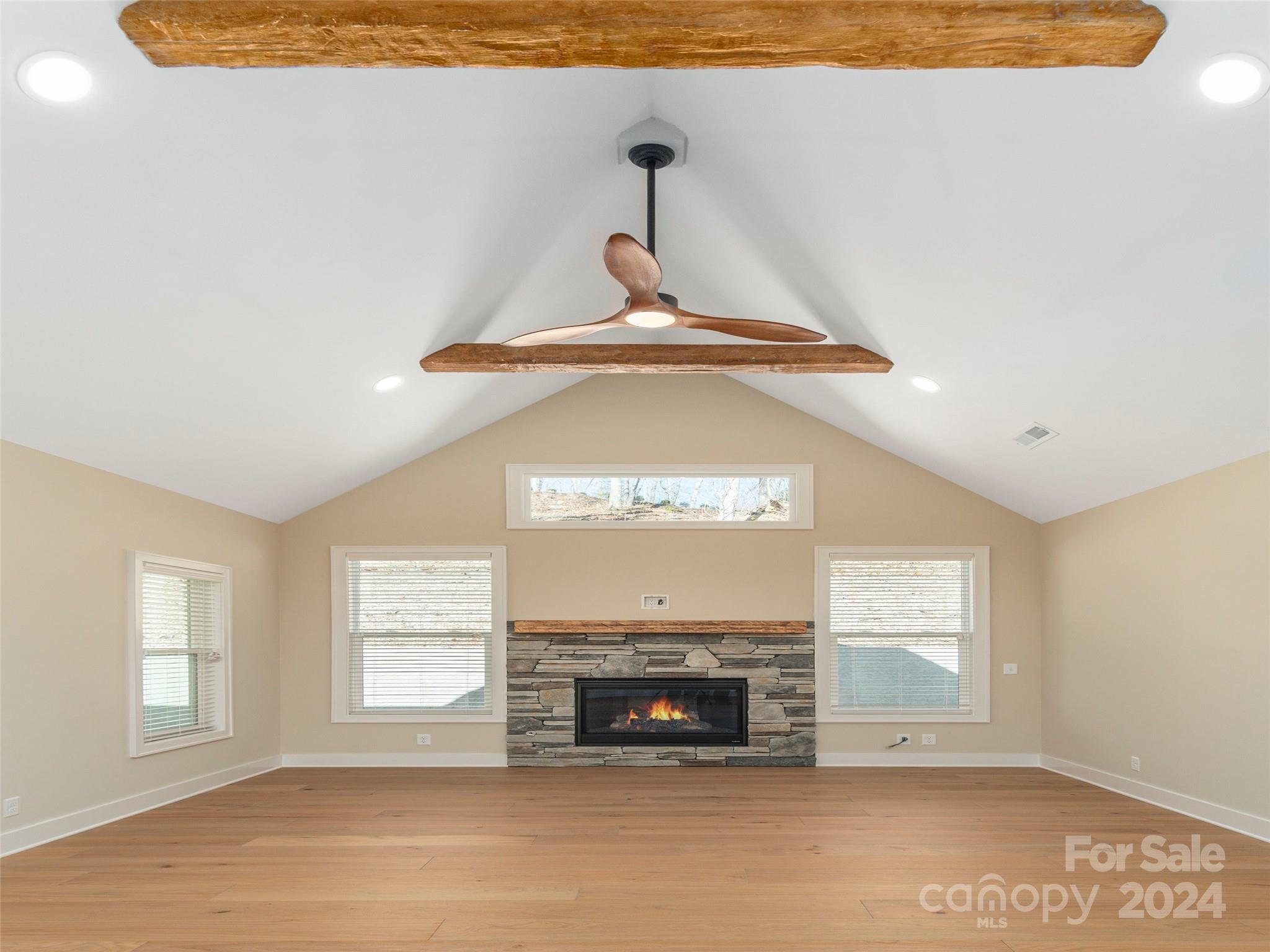 113 Millbrae Loop Hendersonville, NC 28791 - Photo 8 of 35 a view of an empty room with a fireplace and a window