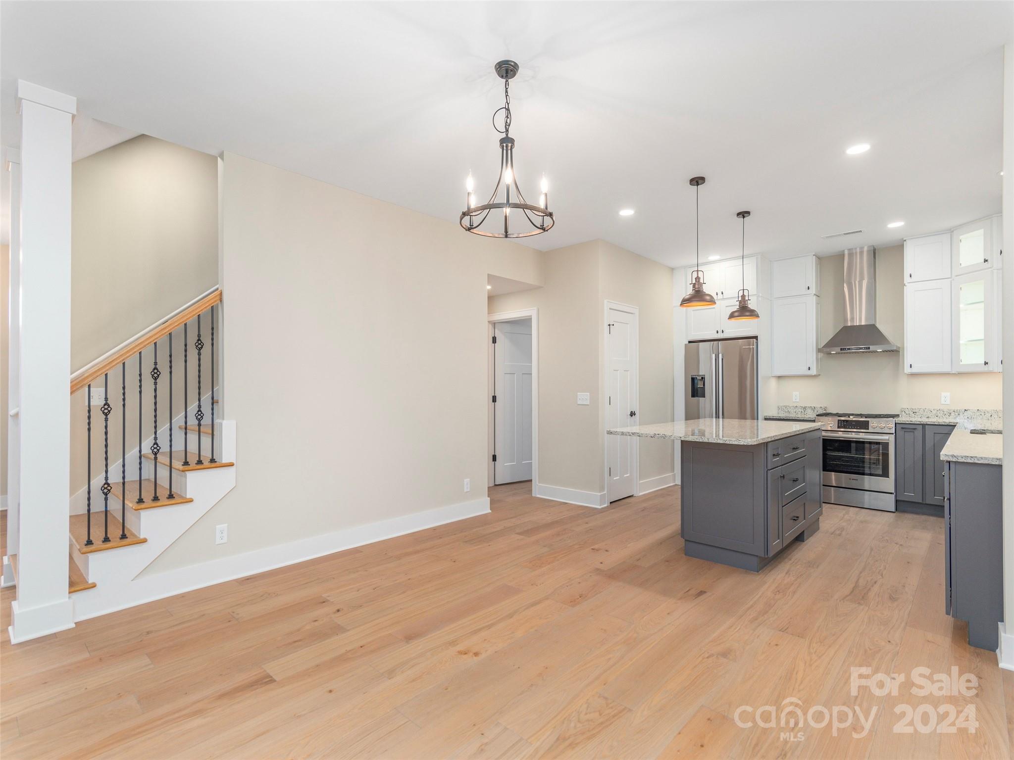 113 Millbrae Loop Hendersonville, NC 28791 - Photo 9 of 35 a view of a kitchen with sink and stainless steel appliances