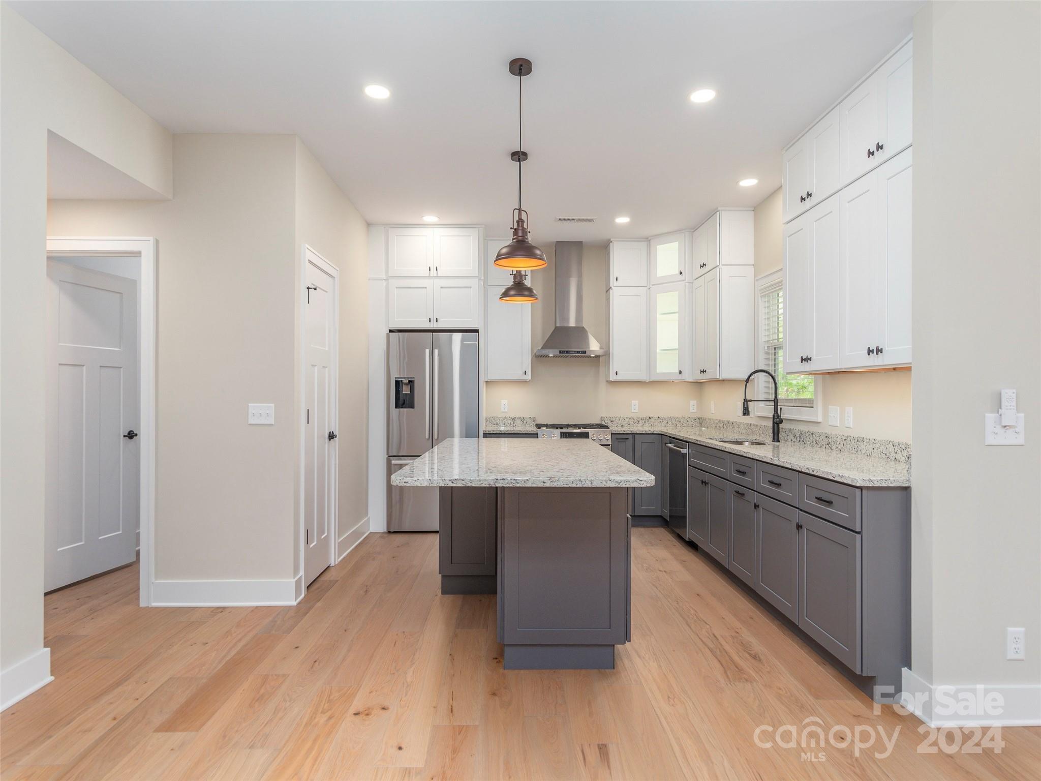 113 Millbrae Loop Hendersonville, NC 28791 - Photo 10 of 35 a large kitchen with stainless steel appliances lots of counter space sink refrigerator and cabinets