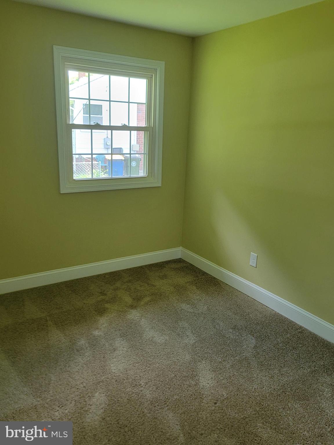 8300 Cathedral Avenue New Carrollton, MD 20784 - Photo 12 of 43 an empty room with a window