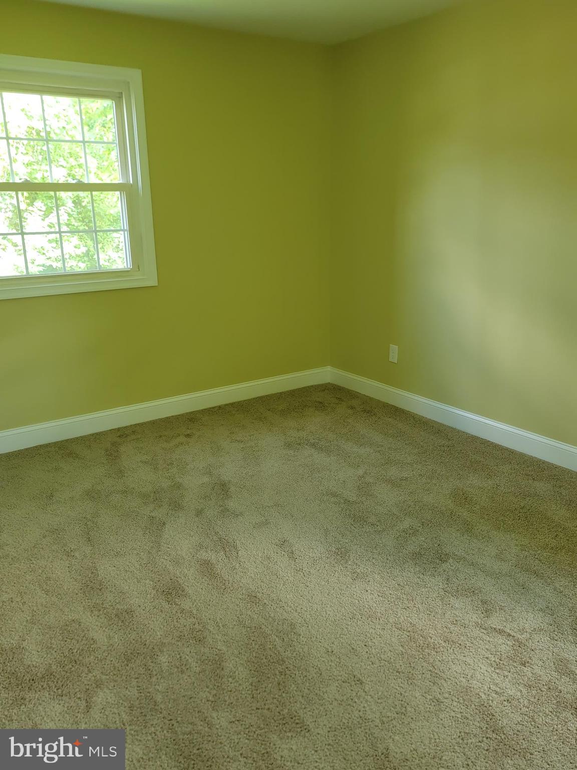8300 Cathedral Avenue New Carrollton, MD 20784 - Photo 13 of 43 an empty room with a window
