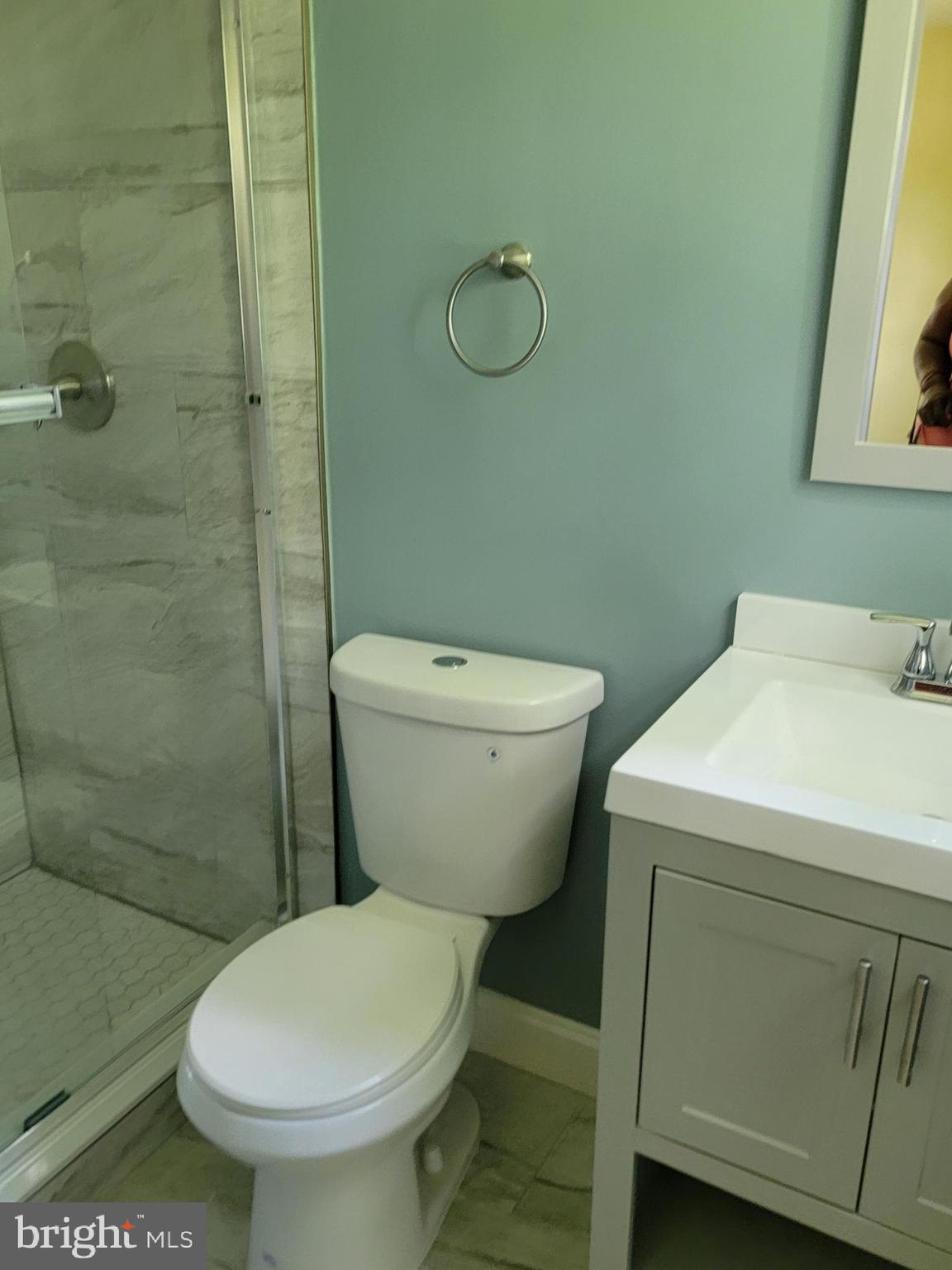 8300 Cathedral Avenue New Carrollton, MD 20784 - Photo 15 of 43 a white toilet sitting next to a bathroom sink