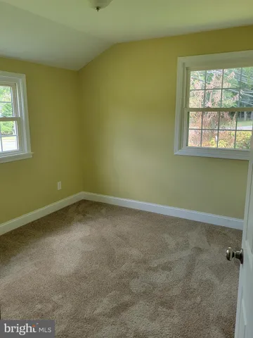 an empty room with wooden door