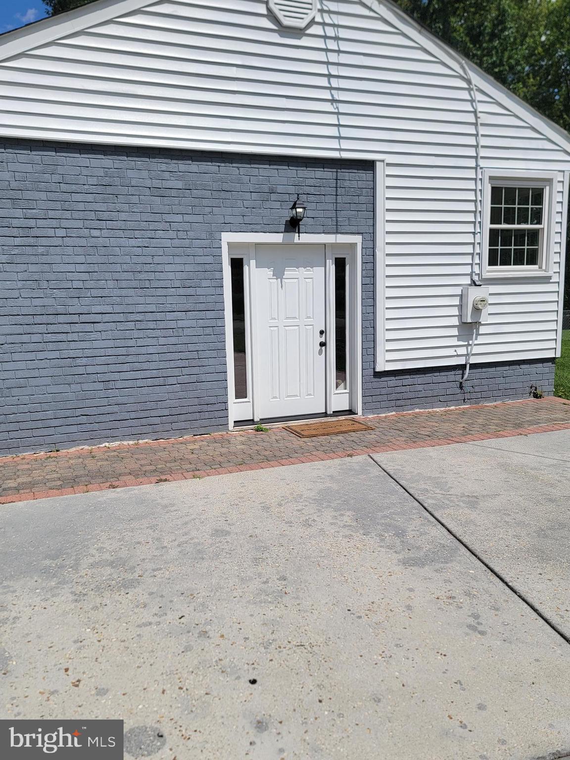 8300 Cathedral Avenue New Carrollton, MD 20784 - Photo 2 of 43 a front view of a house with a garage