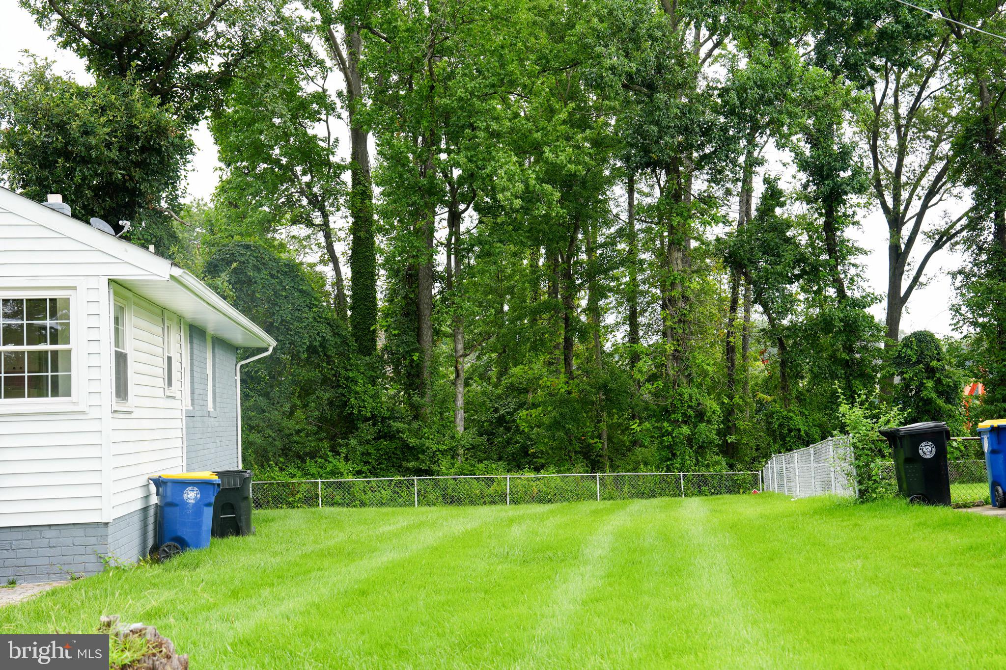8300 Cathedral Avenue New Carrollton, MD 20784 - Photo 22 of 43 a view of a backyard with a small cabin