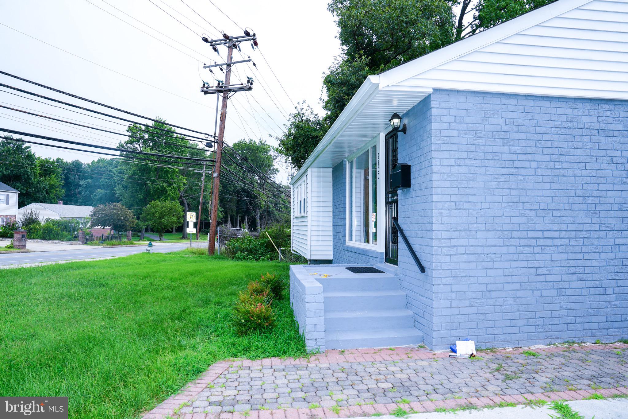8300 Cathedral Avenue New Carrollton, MD 20784 - Photo 25 of 43 a front view of a house with garden