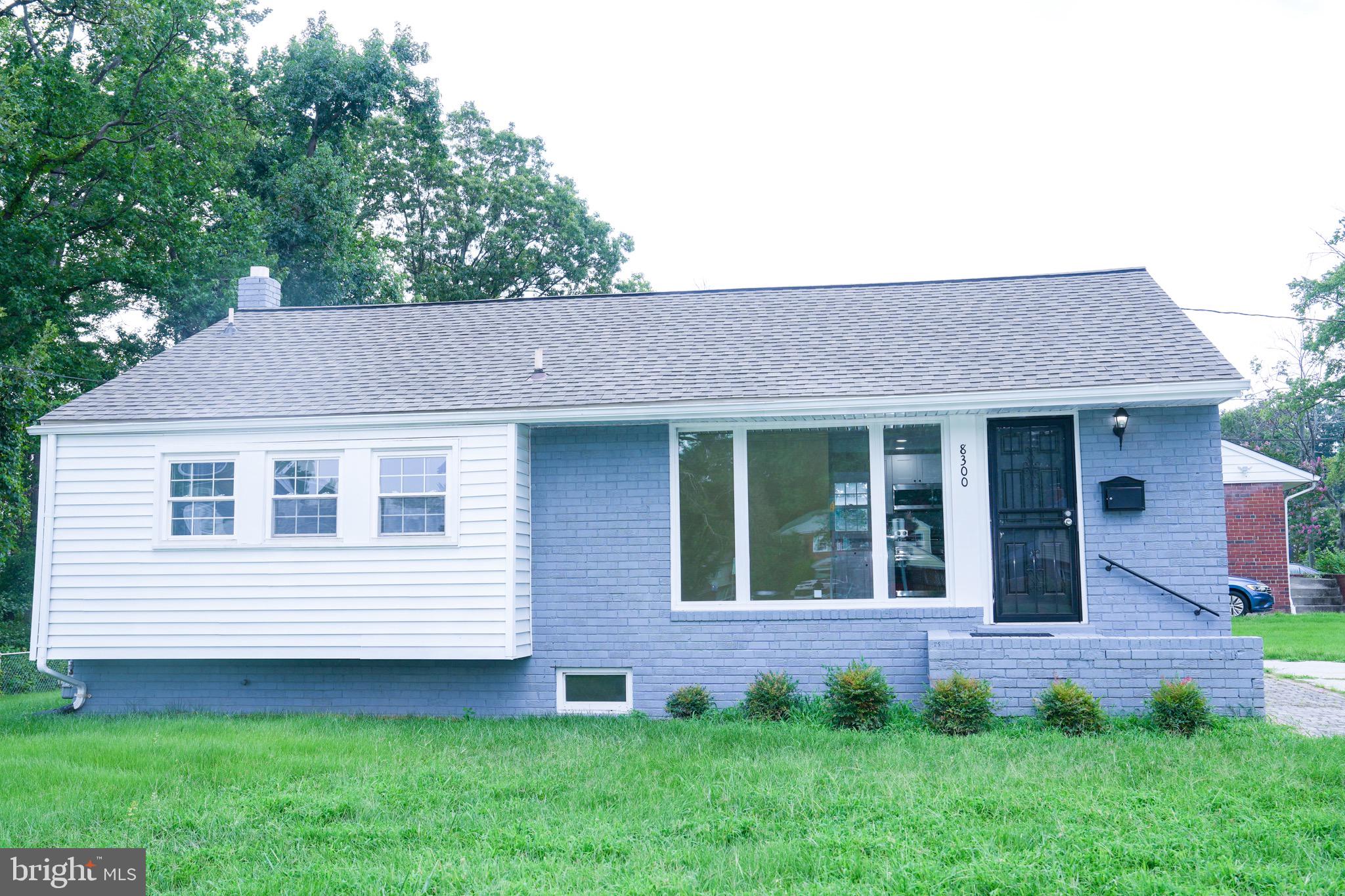 8300 Cathedral Avenue New Carrollton, MD 20784 - Photo 26 of 43 a view of a house with a yard and sitting space