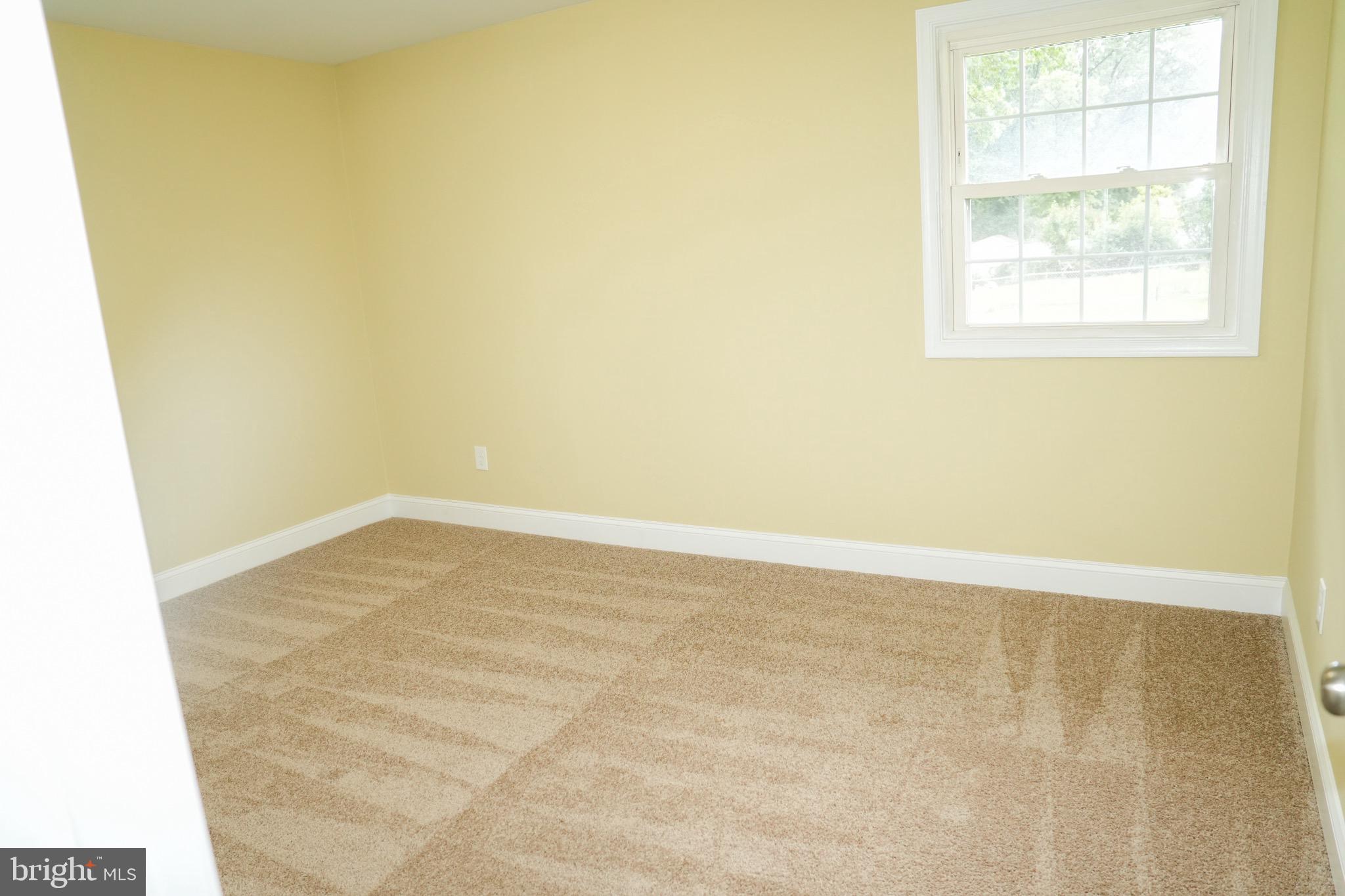8300 Cathedral Avenue New Carrollton, MD 20784 - Photo 29 of 43 an empty room with a window