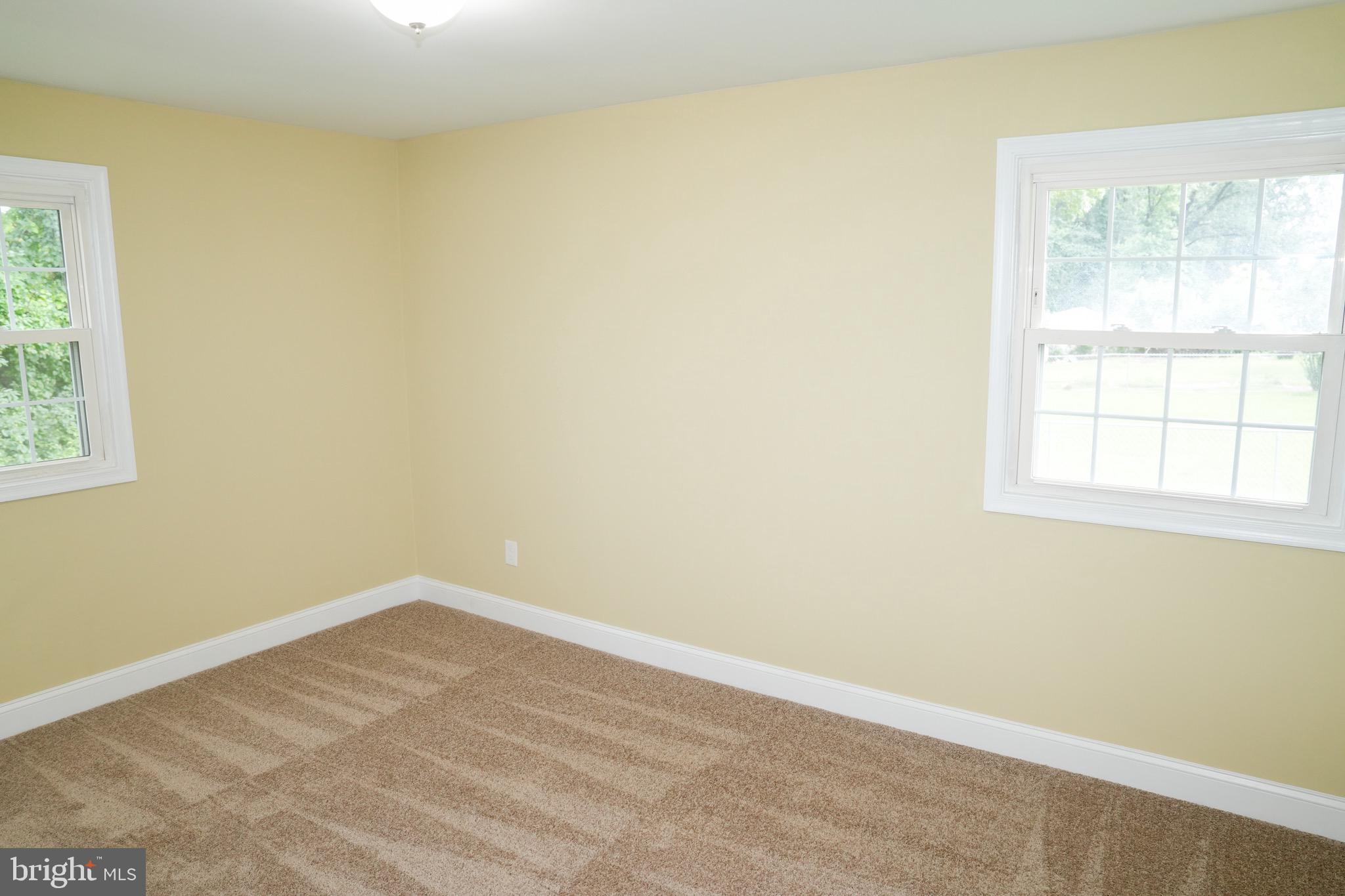 8300 Cathedral Avenue New Carrollton, MD 20784 - Photo 31 of 43 an empty room with a window