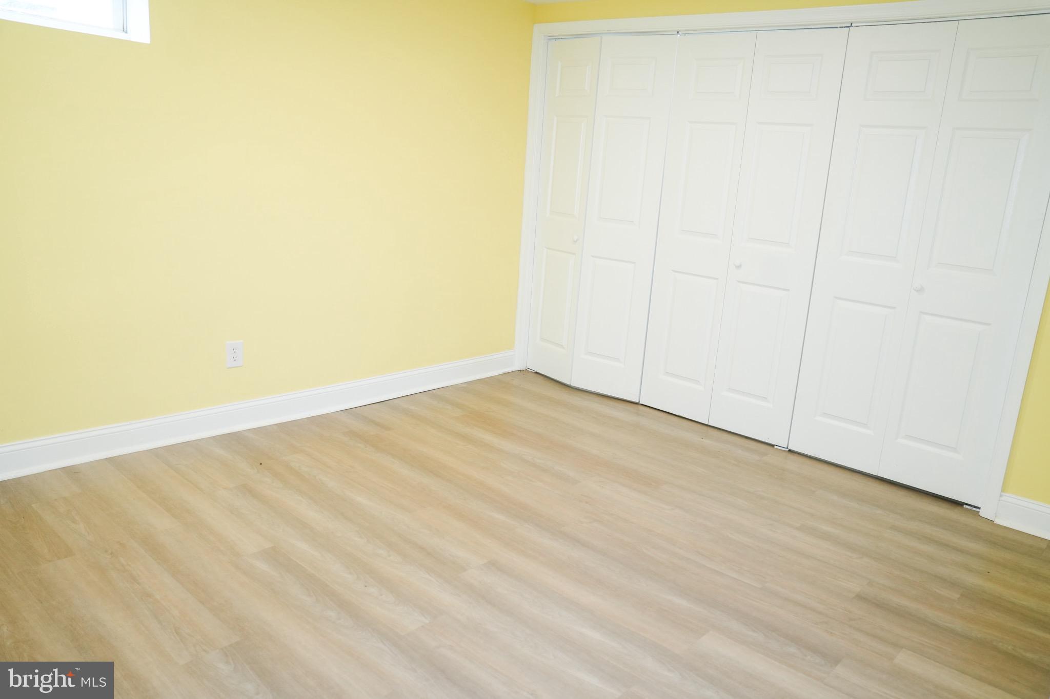 8300 Cathedral Avenue New Carrollton, MD 20784 - Photo 40 of 43 a view of empty room with wooden floor