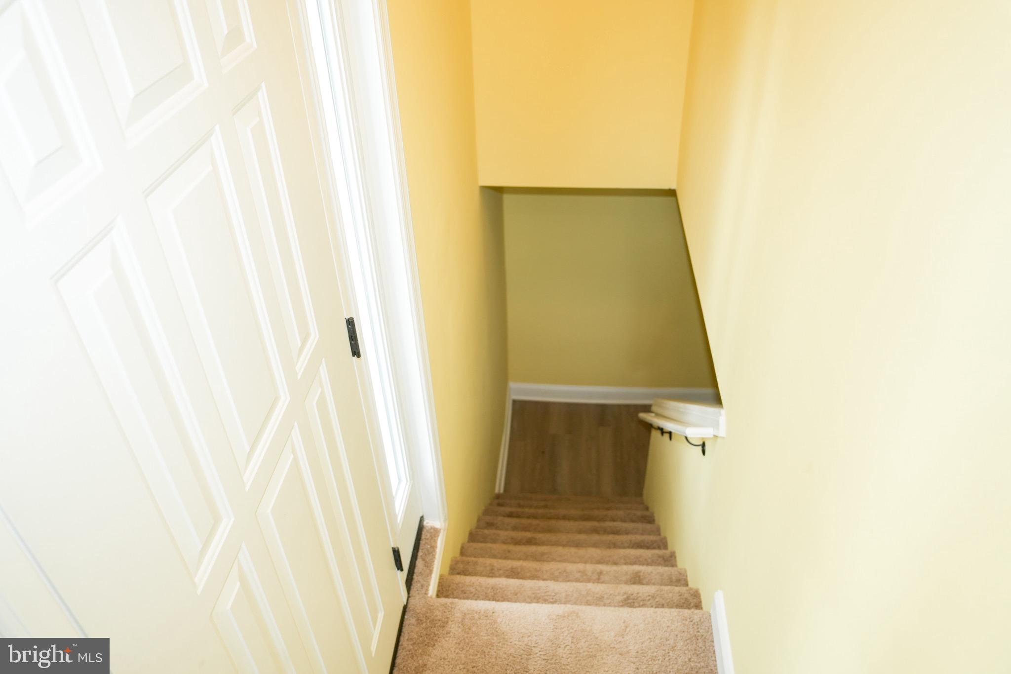 8300 Cathedral Avenue New Carrollton, MD 20784 - Photo 43 of 43 a view of a hallway with wooden floor