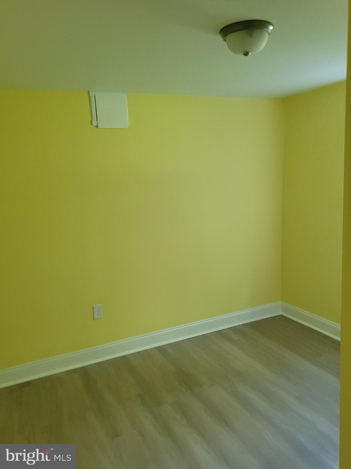 8300 Cathedral Avenue New Carrollton, MD 20784 - Photo 6 of 43 a view of a room with wooden floor