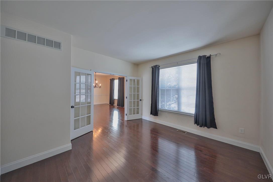 41 Joy Circle Barto, PA 19504 - Photo 13 of 57 an empty room with wooden floor and windows