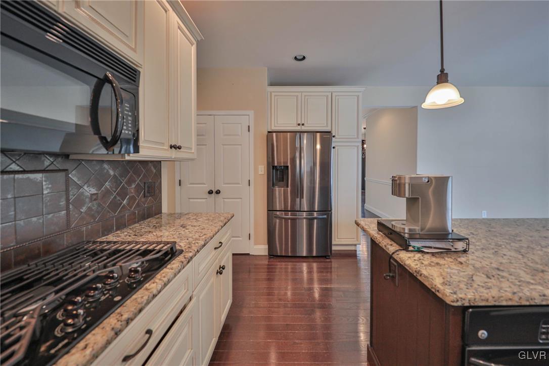 41 Joy Circle Barto, PA 19504 - Photo 22 of 57 a kitchen with granite countertop a sink stove and refrigerator