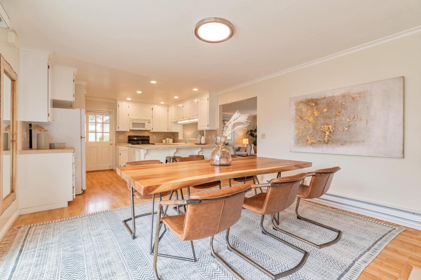 1298 Reeve Street Santa Clara, CA 95050 - Photo 14 of 28 a table and chairs in a room