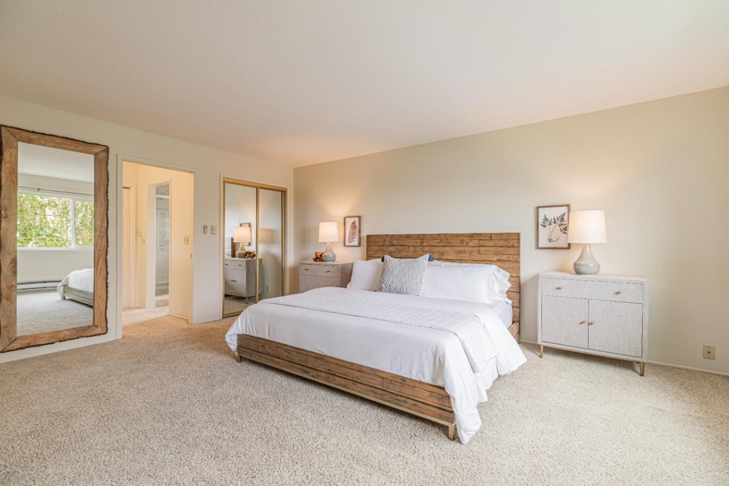 1298 Reeve Street Santa Clara, CA 95050 - Photo 20 of 28 a spacious bedroom with a bed and cabinets