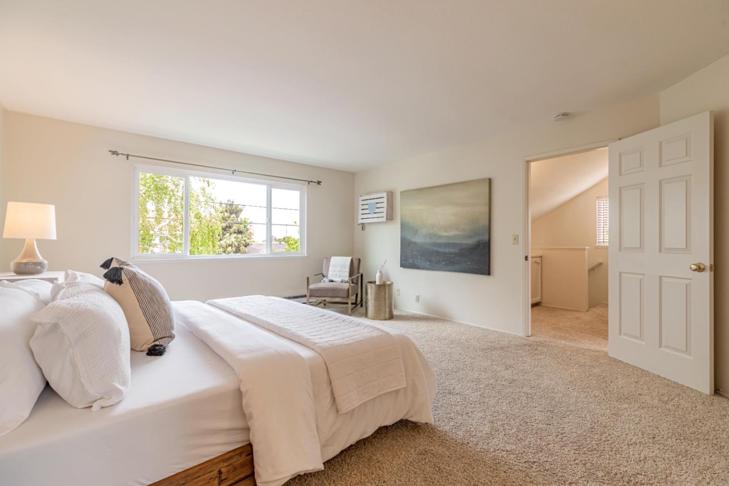 1298 Reeve Street Santa Clara, CA 95050 - Photo 21 of 28 a bedroom with a bed and a window