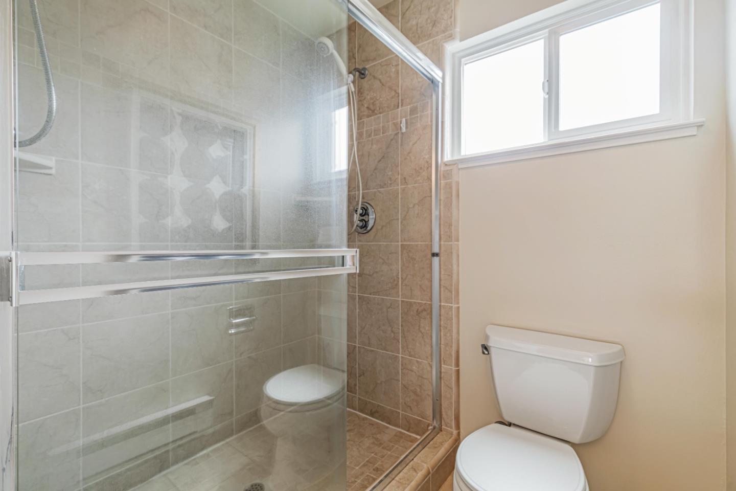 1298 Reeve Street Santa Clara, CA 95050 - Photo 24 of 28 a bathroom with a toilet and a shower