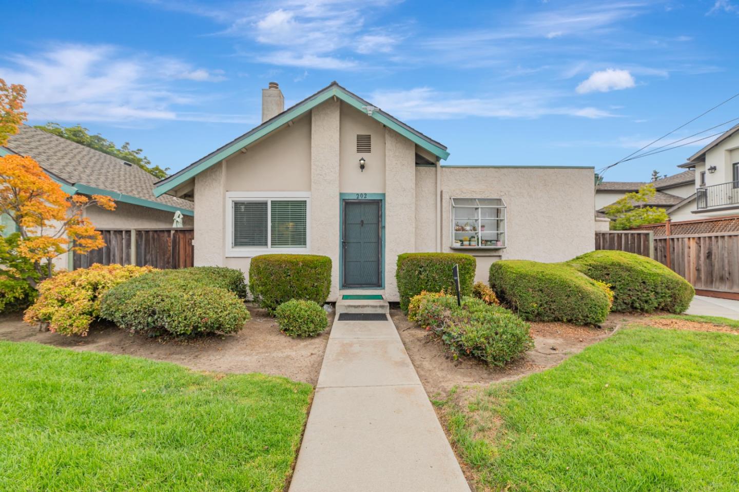 1298 Reeve Street Santa Clara, CA 95050 - Photo 3 of 28 a front view of a house with garden