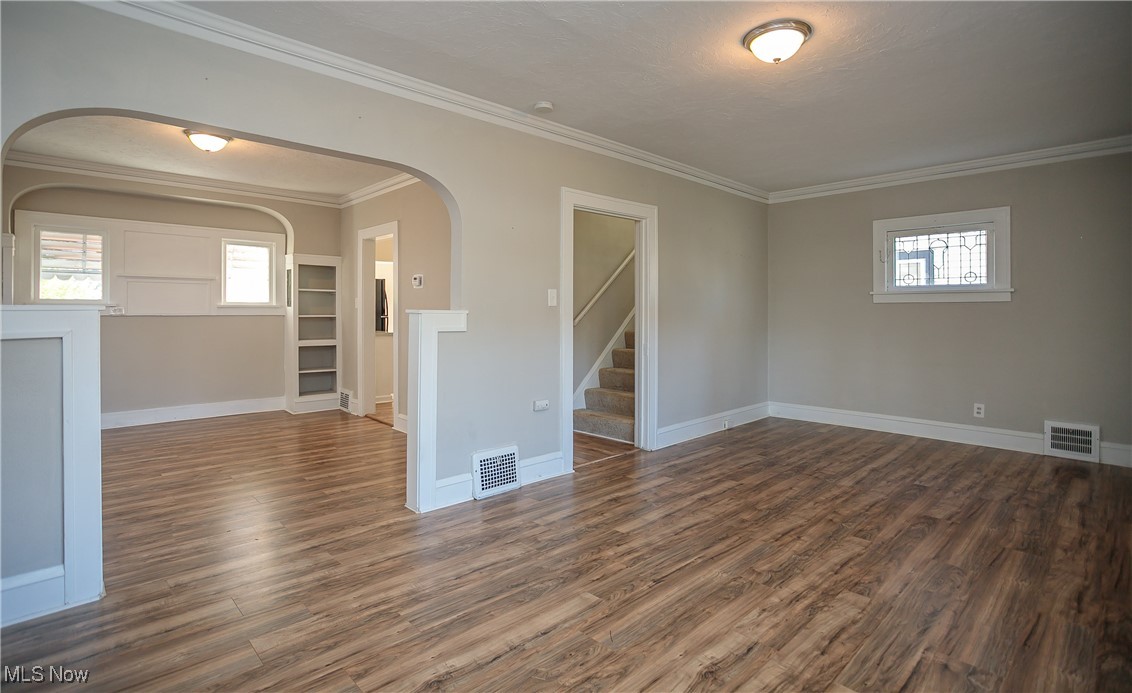 3666 Ludgate Road Cleveland, OH 44120 - Photo 6 of 22 Unfurnished room with crown molding and dark hardwood / wood-style floors