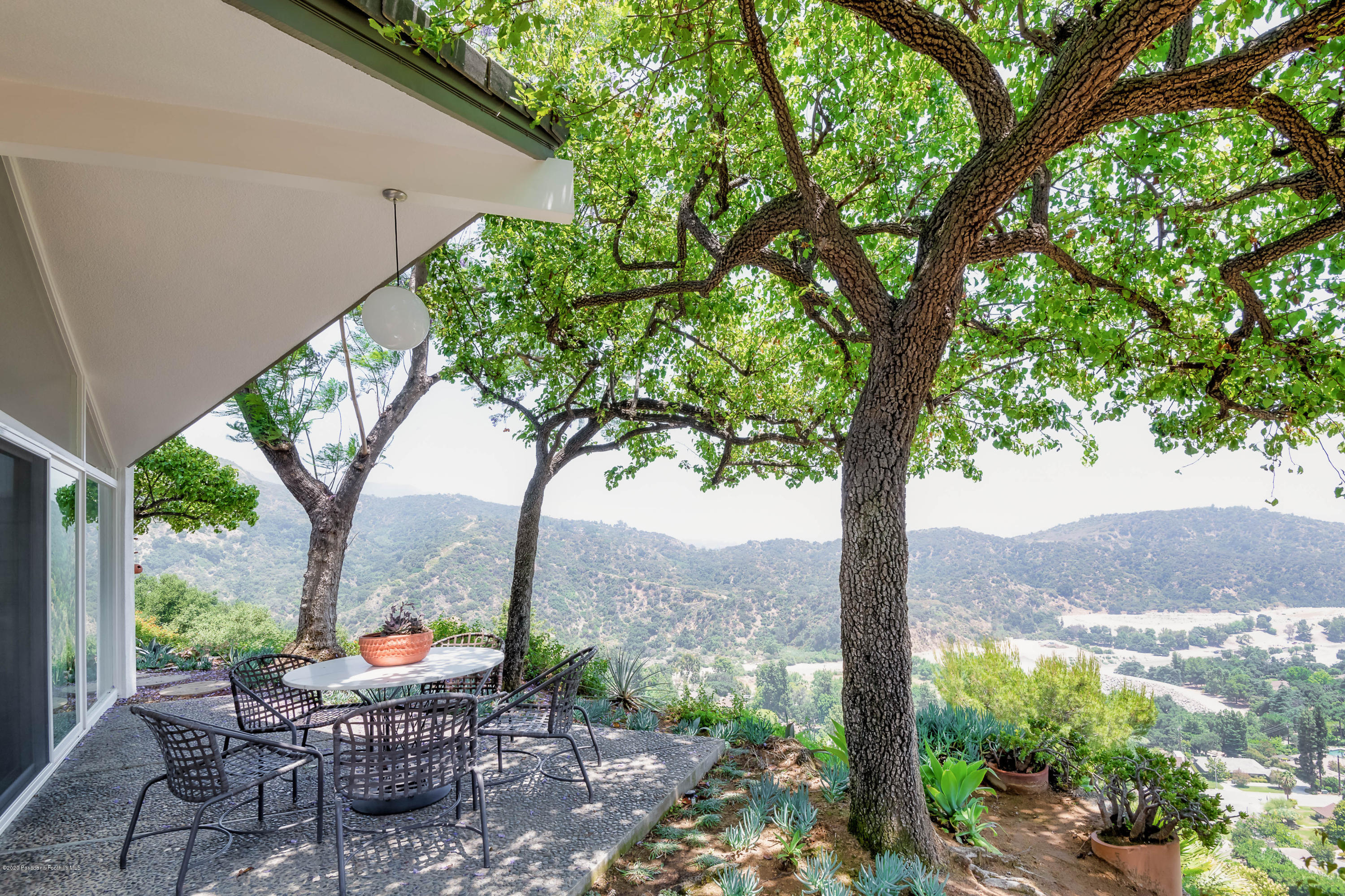 2210 Cielo Place Arcadia, CA 91006 - Photo 30 of 39 a view of a backyard with table and chairs plants and large trees