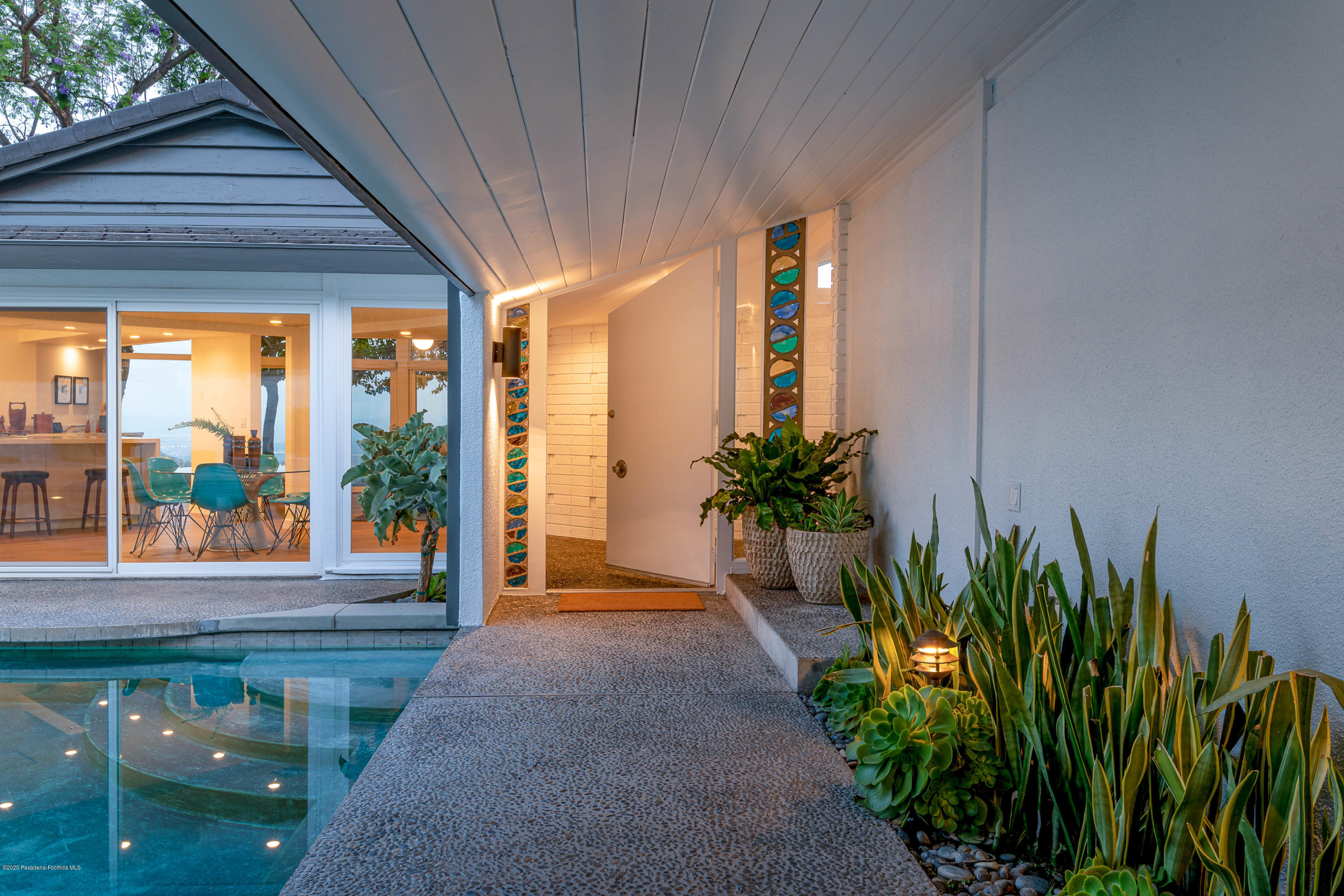 2210 Cielo Place Arcadia, CA 91006 - Photo 34 of 39 a porch with a potted plant in front of a house