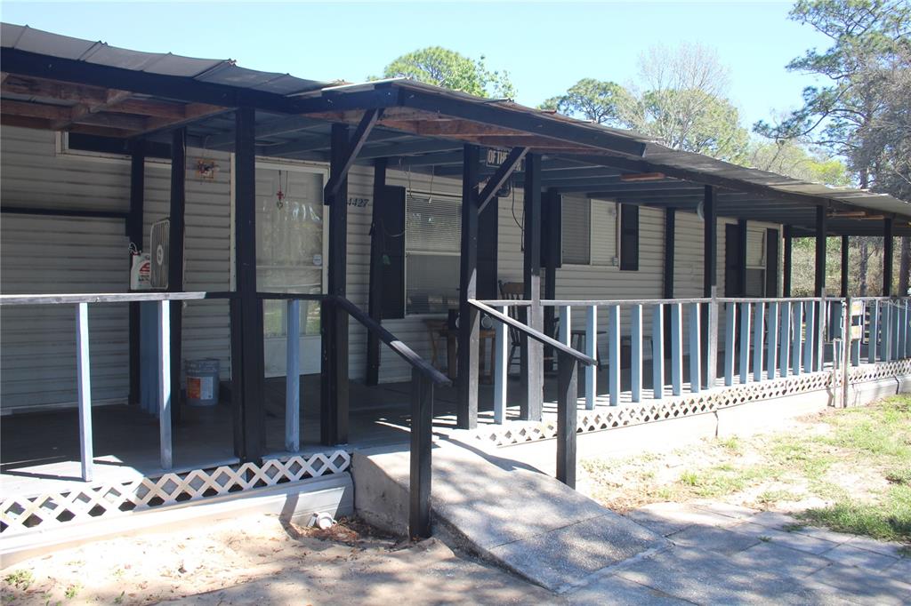 24427 Wild Turkey Road Paisley, FL 32767 - Photo 2 of 55 a view of a house with a wooden fence