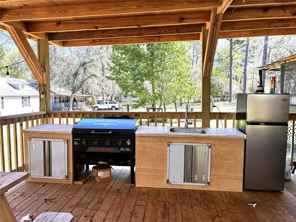 24427 Wild Turkey Road Paisley, FL 32767 - Photo 21 of 55 a living room with a large window and table