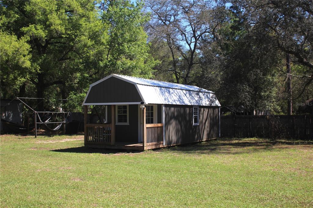 24427 Wild Turkey Road Paisley, FL 32767 - Photo 24 of 55 a view of a house with backyard and trees