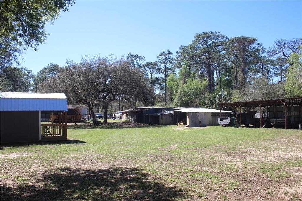 24427 Wild Turkey Road Paisley, FL 32767 - Photo 25 of 55 a view of a house with a yard and sitting area
