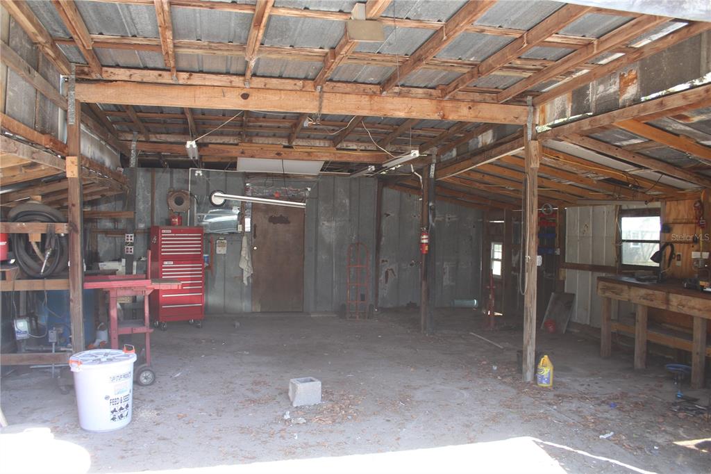 24427 Wild Turkey Road Paisley, FL 32767 - Photo 28 of 55 a view of a storage room with racks