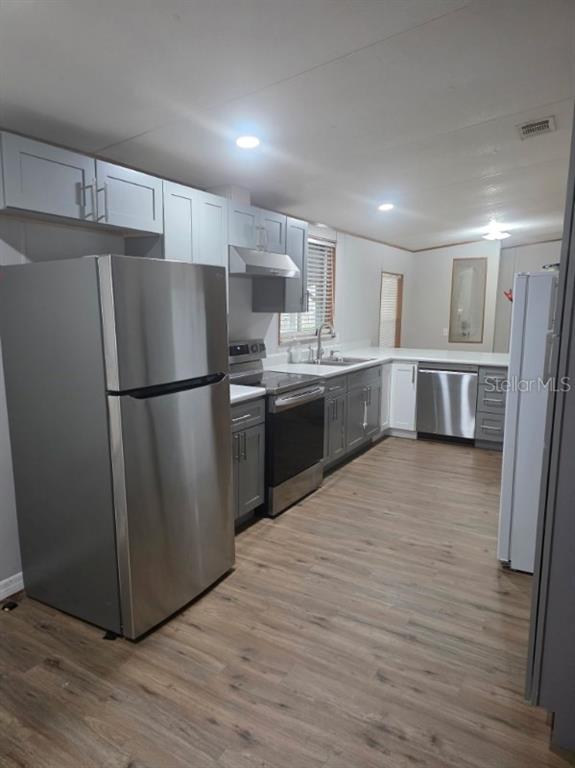 24427 Wild Turkey Road Paisley, FL 32767 - Photo 4 of 55 a open kitchen with stainless steel appliances granite countertop a refrigerator and a stove top oven