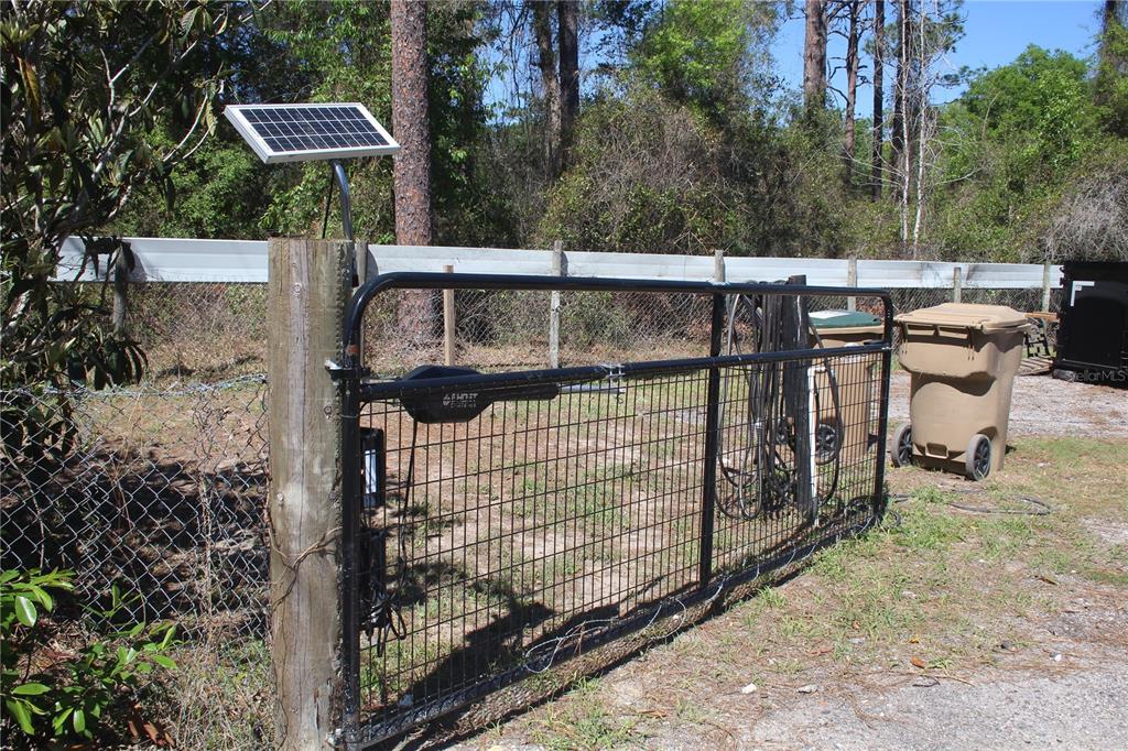 24427 Wild Turkey Road Paisley, FL 32767 - Photo 49 of 55 a view of a backyard with a iron fence