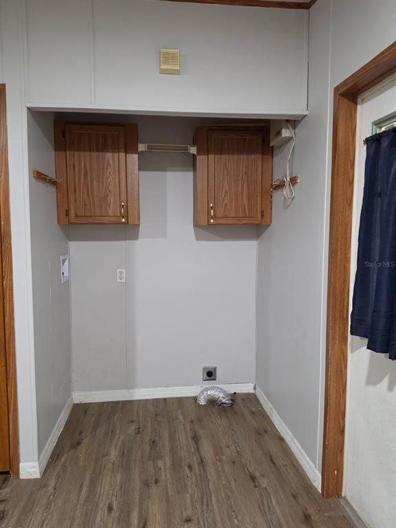 24427 Wild Turkey Road Paisley, FL 32767 - Photo 9 of 55 a view of an empty room with wooden floor and a window
