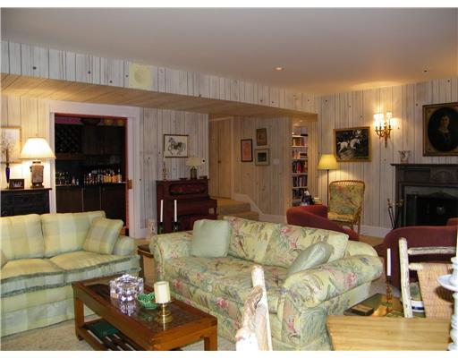 209 Spanish Tract Road Edgeworth, PA 15143 - Photo 14 of 18 Family Room. Spacious Family Room includes log burning fireplace with slate hearth, bar area, and direct access to the veranda and pool.