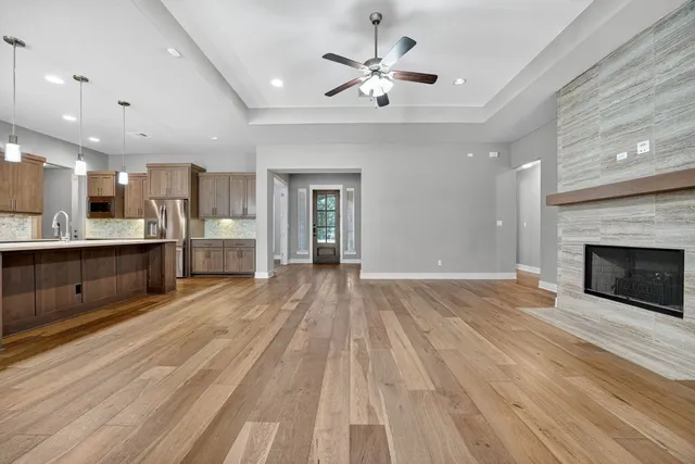 a view of a kitchen with a sink and a fireplace