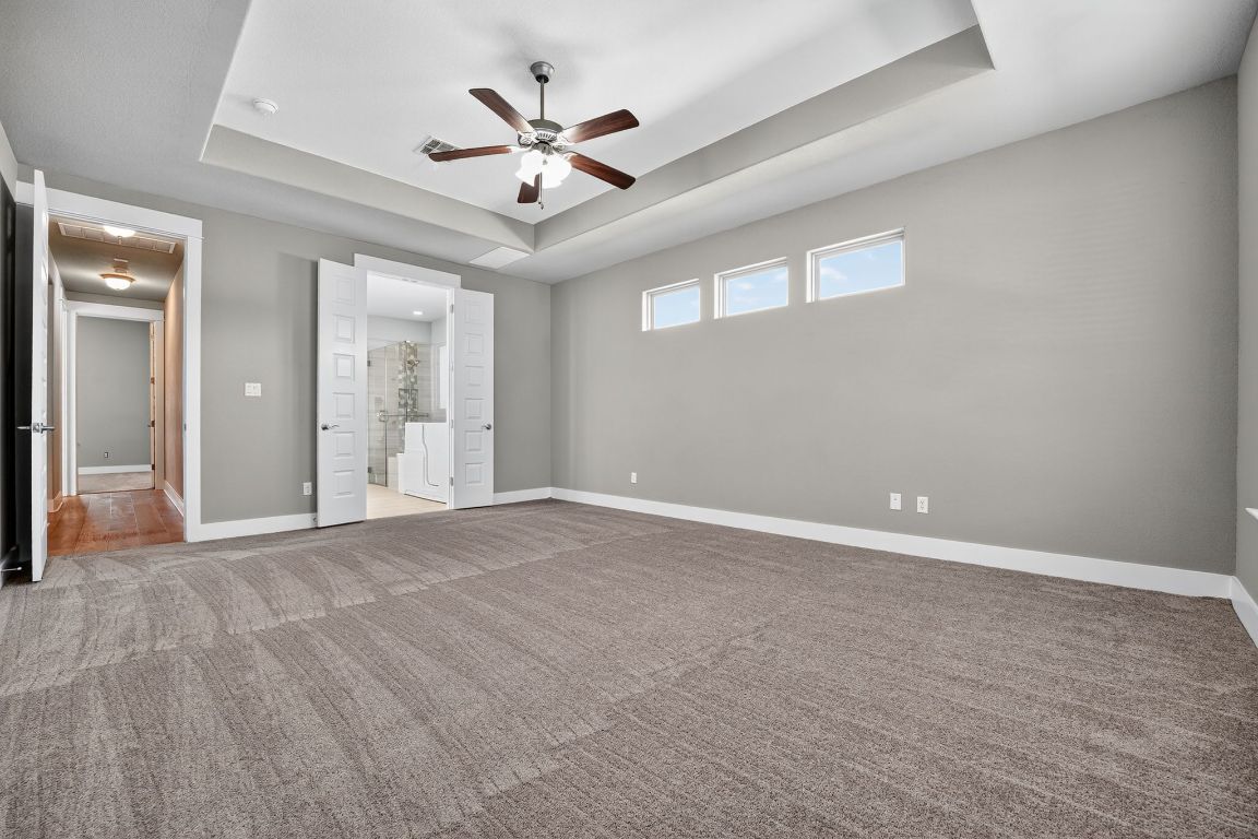 112 Sweetleaf Cove Georgetown, TX 78633 - Photo 19 of 28 an empty room with fan and a ceiling fan