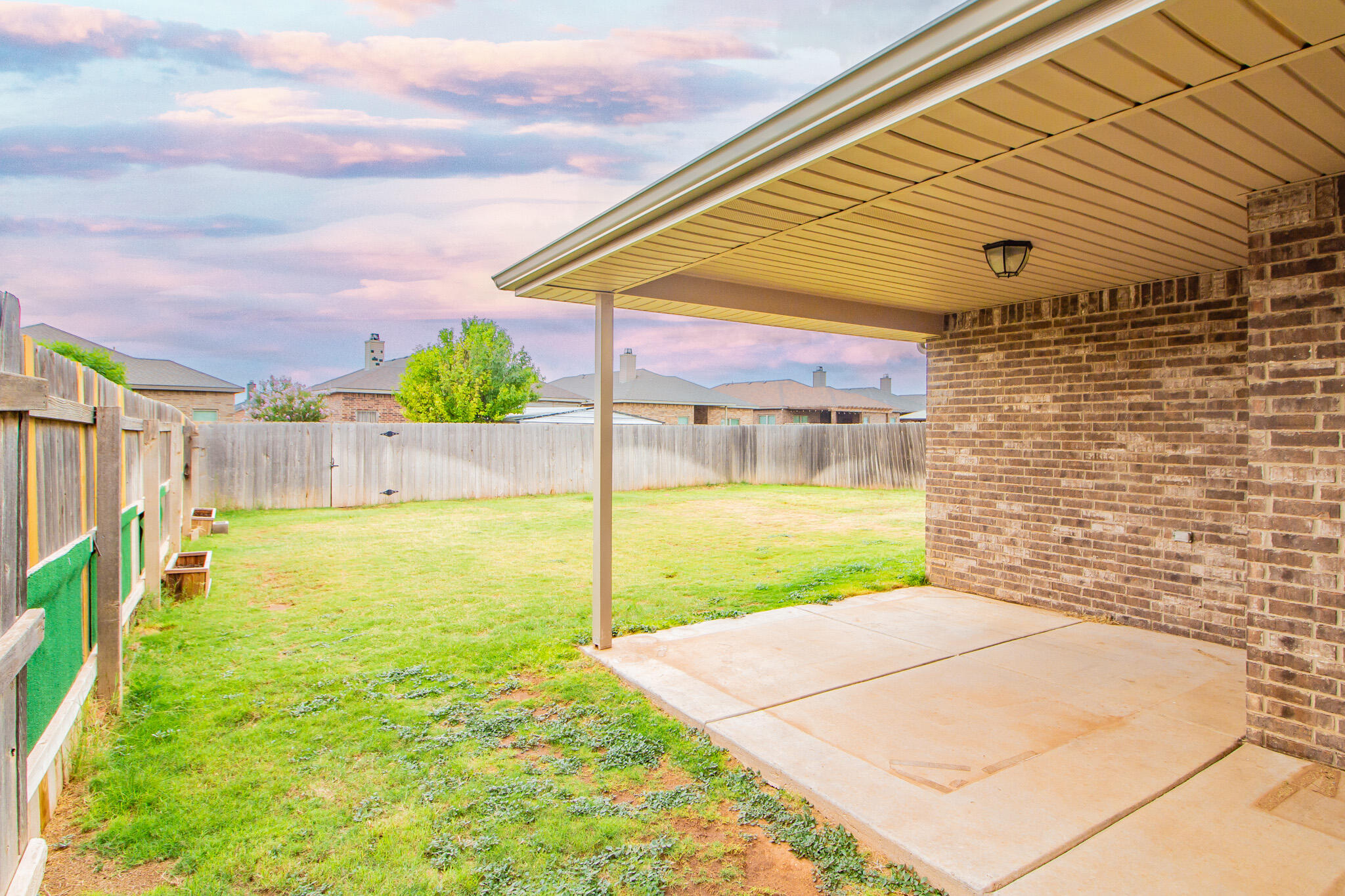 7409 101st Street Lubbock, TX 79424 - Photo 19 of 22 a view of a back yard of the house