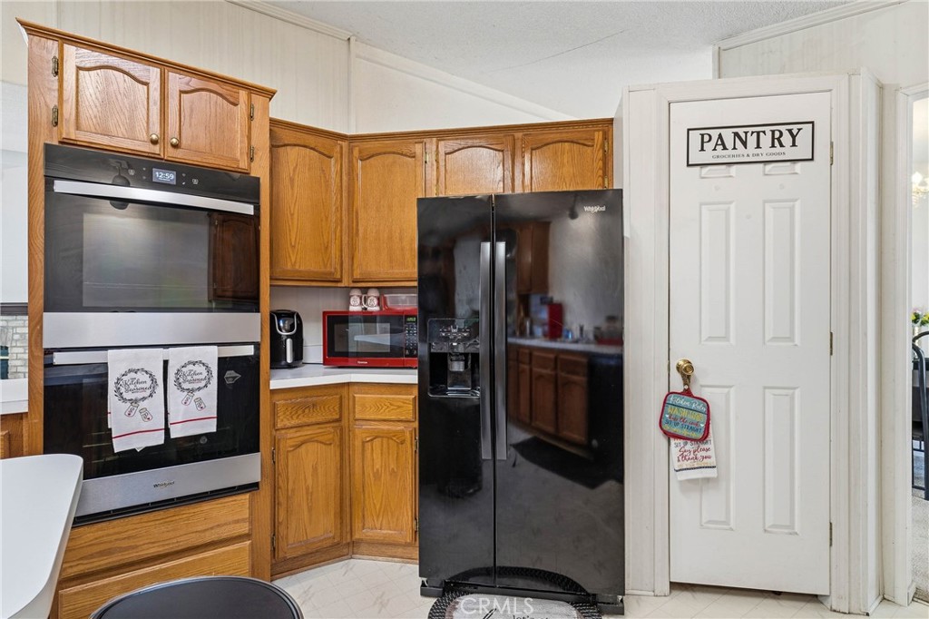 7765 Verna Way Lucerne, CA 95458 - Photo 11 of 37 a living room with furniture and a flat screen tv