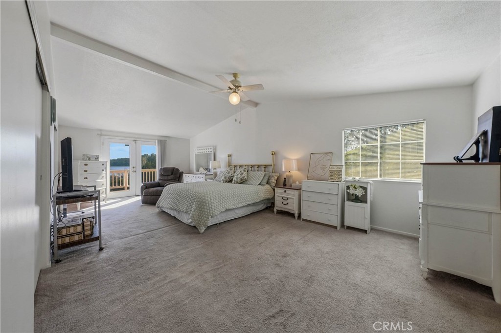 7765 Verna Way Lucerne, CA 95458 - Photo 12 of 37 a living room with furniture and a flat screen tv
