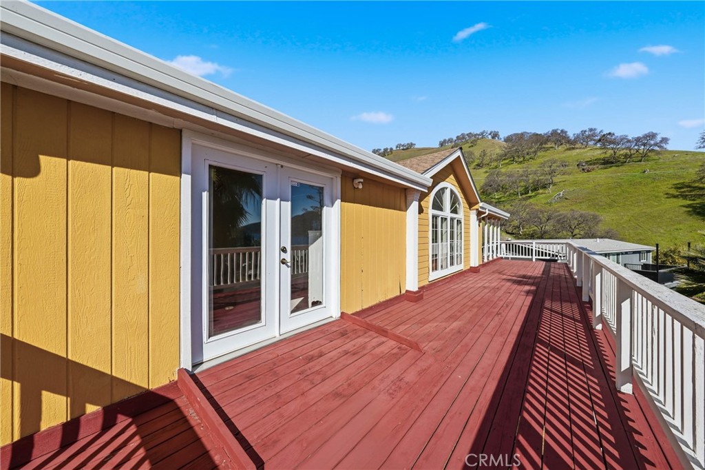 7765 Verna Way Lucerne, CA 95458 - Photo 26 of 37 a view of a house with backyard and deck