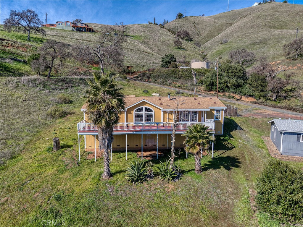 7765 Verna Way Lucerne, CA 95458 - Photo 33 of 37 an aerial view of a house with a yard and balcony