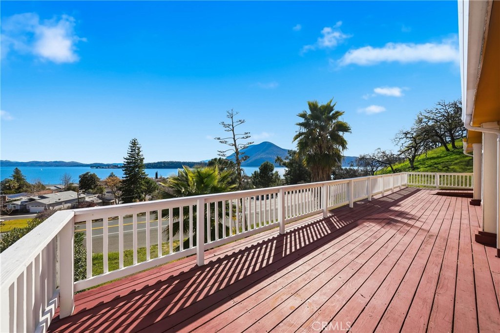 7765 Verna Way Lucerne, CA 95458 - Photo 4 of 37 a view of balcony with wooden floor and fence