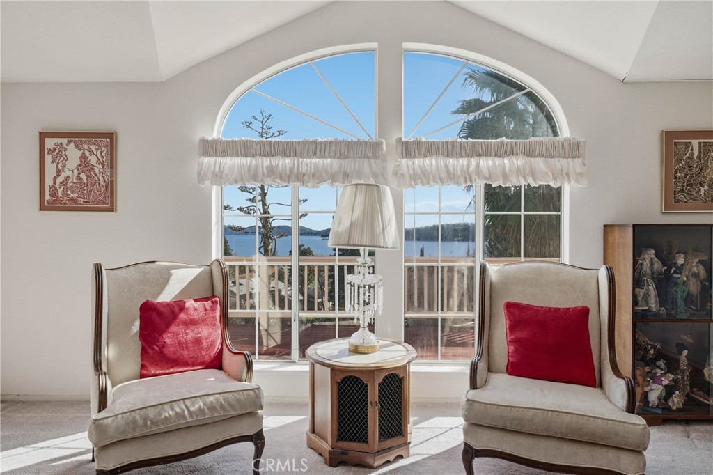7765 Verna Way Lucerne, CA 95458 - Photo 6 of 37 a living room with furniture and a floor to ceiling window