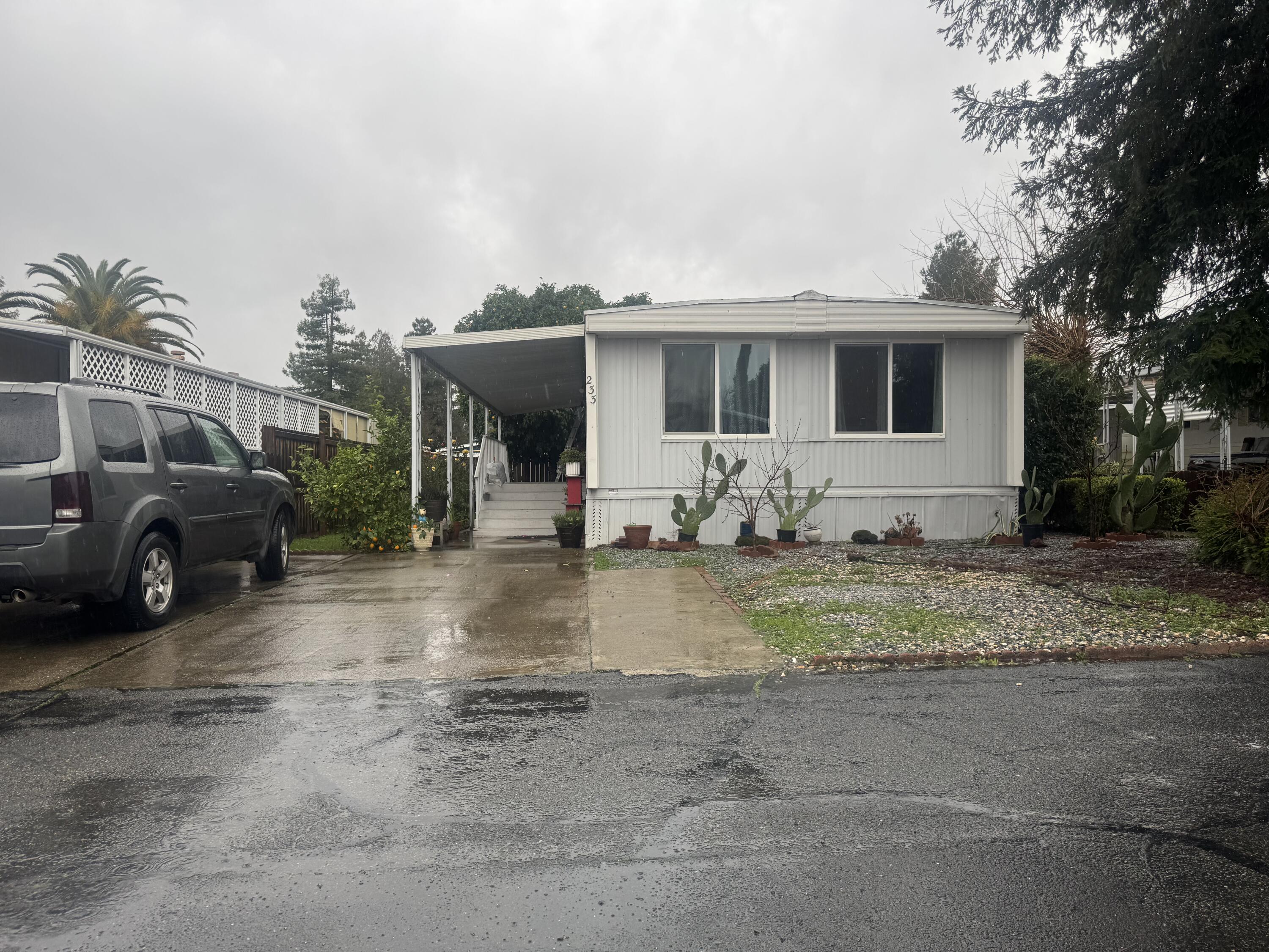 a view of a yard with car parked